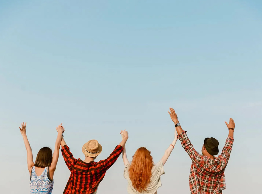 Happy people against a blue sky